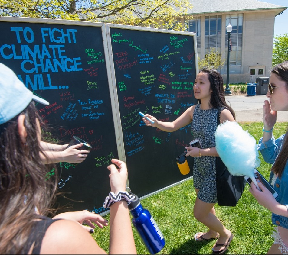 Students discussing sustainability on the quad